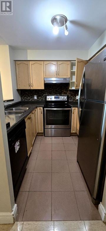 Toronto (Newtonbrook East) condo for rent - A kitchen with black appliances and brown tile flooring.