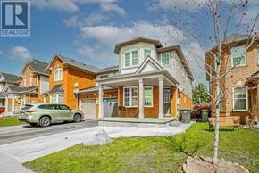 Brampton (Fletcher's Meadow) apartment for rent - A house with a car parked in front of it.