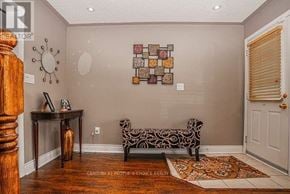 Brampton (Fletcher's Meadow) apartment for rent - A room with a wooden table and a zebra print bench.
