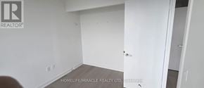 Mississauga (City Centre) condo for rent - A white room with a door on the right side.