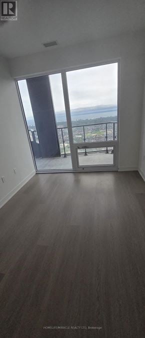 Mississauga (City Centre) condo for rent - A room with a balcony overlooking a view.