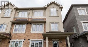 Brampton (Credit Valley) apartment for rent - A building with the sign "REALTOR" on the front.