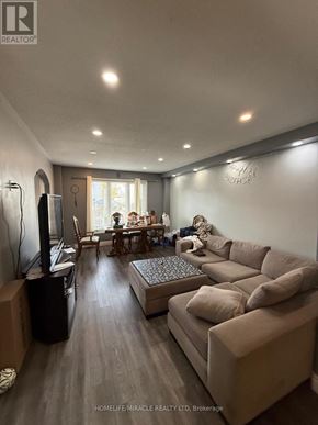 Kingston (City Northwest) apartment for rent - A living room with a couch, a television, and a coffee table.
