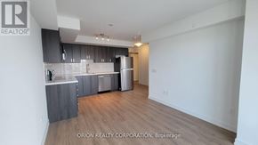 Pickering (Bay Ridges) condo for rent - A kitchen with a counter top and cabinets.