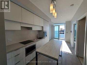 Toronto (Mount Pleasant West) condo for rent - A kitchen with a table and chairs in the middle of the room.