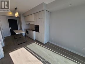 Toronto (Mount Pleasant West) condo for rent - A kitchen with a table and chairs is shown in the image.
