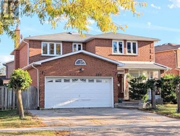 Toronto (Milliken) apartment for rent - A two-story house with a white garage door.