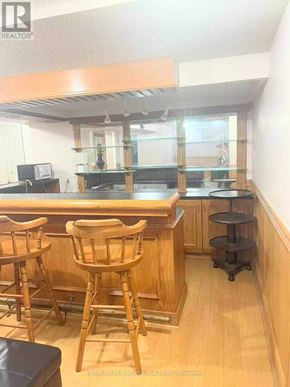 Toronto (Milliken) apartment for rent - A bar area with two stools and a counter.