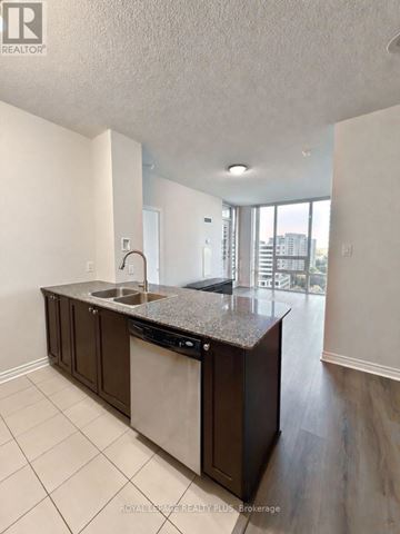 Mississauga (Fairview) condo for rent - A kitchen with granite countertops and a sink.