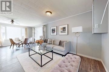Ramara apartment for rent - A living room with a glass coffee table and a couch with a pillow that says "Live Love Love".
