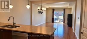 St. Catharines (Oakdale) townhouse for rent - A kitchen with a sink and a counter top.