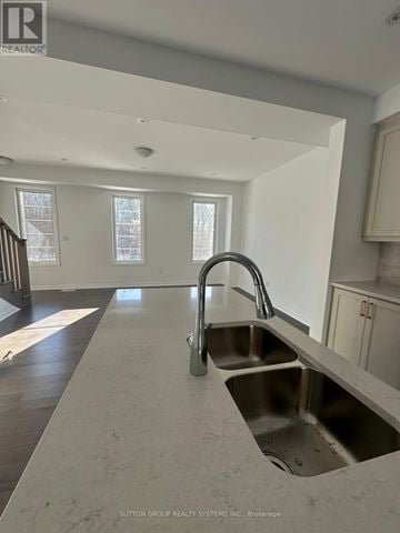 Oakville (Go Glenorchy) townhouse for rent - A kitchen with a sink and a window.
