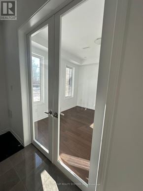 Oakville (Go Glenorchy) townhouse for rent - A glass door leading to a hallway.