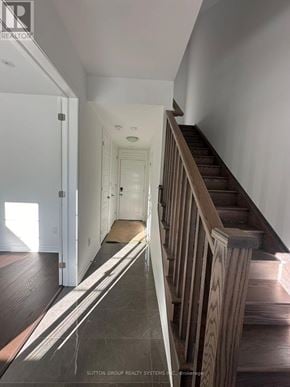 Oakville (Go Glenorchy) townhouse for rent - A hallway with a staircase leading to the second floor.
