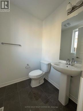Oakville (Go Glenorchy) townhouse for rent - A white toilet and sink in a bathroom.