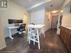 Toronto (Waterfront Communities) condo for rent - A room with a desk and chairs.