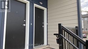 Ottawa townhouse for rent - A blue door with a number 1469 on the wall above it.