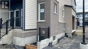 Ottawa townhouse for rent - A house with a sign that says "Welcome Home" on the front.