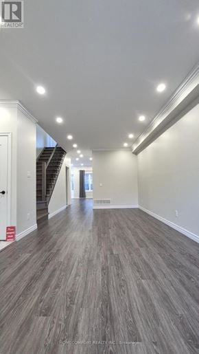 Richmond Hill (Langstaff) apartment for rent - A long hallway with wood floors and recessed lighting.