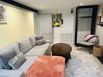 Gatineau (Gatineau) condo for rent - A living room with a grey couch and a brown coffee table.