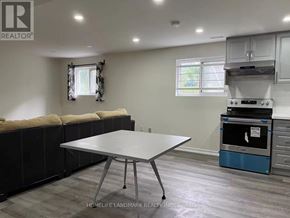 Toronto (Pleasant View) apartment for rent - A kitchen area with a table and a stove.