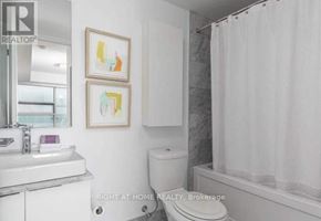 Toronto (Waterfront Communities) condo for rent - A bathroom with a toilet, sink, and shower.