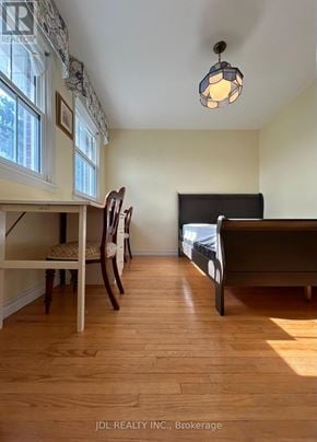 Toronto (Parkwoods-Donalda) apartment for rent - A bedroom with a bed, chair, and window.
