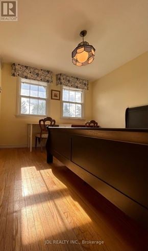 Toronto (Parkwoods-Donalda) apartment for rent - A room with wooden floors and a window with curtains.