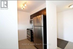 Toronto (Bendale) condo for rent - A kitchen with a stainless steel refrigerator and microwave.