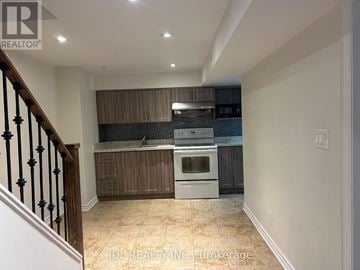Markham (Buttonville) apartment for rent - A kitchen with a stove top oven and a microwave.