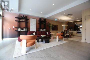 Oakville (Jm Joshua Meadows) condo for rent - A living room with a white rug and a brown couch.
