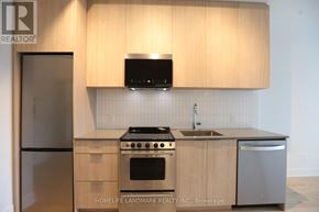 Oakville (Jm Joshua Meadows) condo for rent - A kitchen with wooden cabinets and a stainless steel dishwasher.