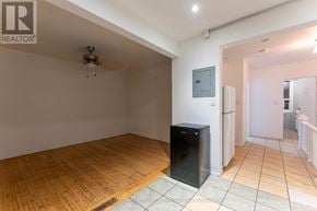 Toronto (Dovercourt-Wallace Emerson-Junction) triplex for rent - A room with wooden flooring and a flat screen TV.