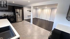 London East (East C) apartment for rent - A kitchen with a sink, stove, and refrigerator.