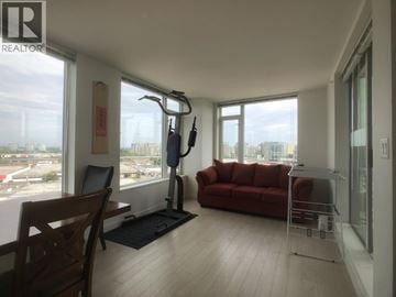 Richmond apartment for rent - A living room with a red couch and a wooden chair.