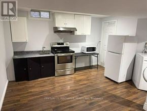 Markham (Cedarwood) apartment for rent - A kitchen with wooden floors and white appliances.