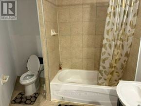 Markham (Cedarwood) apartment for rent - A bathroom with a toilet, sink, and bathtub.