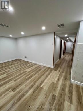 Toronto (Keelesdale-Eglinton West) apartment for rent - A long hallway with wood flooring and white walls.