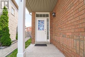 Mississauga (East Credit) apartment for rent - A brick wall with a white door and a glass window.