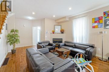 Mississauga (East Credit) apartment for rent - A living room with a grey couch and a wooden floor.