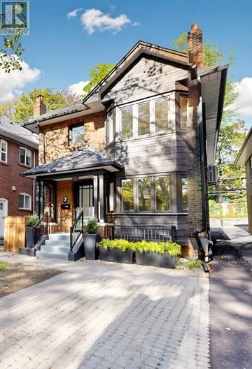 Toronto (Mount Pleasant West) apartment for rent - A house with a grey front and a black roof.