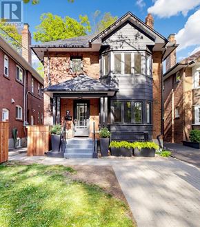 Toronto (Mount Pleasant West) apartment for rent - A house with a grey front yard and a black gate.