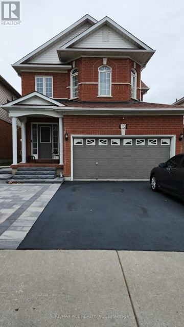 Toronto (West Hill) apartment for rent - A brick house with a black car in front of it.