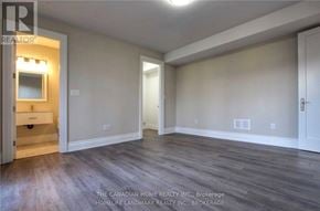 Toronto (Agincourt South-Malvern West) apartment for rent - A room with wood flooring and a white door.