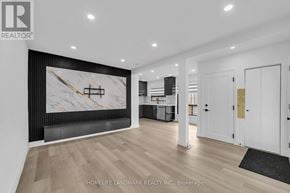 Toronto (Kennedy Park) apartment for rent - A modern living room with a large marble wall art and wooden flooring.