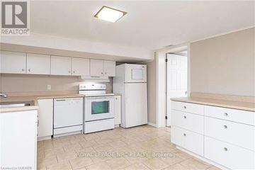 Milton (Mn Milton North) apartment for rent - A white kitchen with a microwave, oven, and dishwasher.