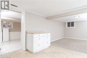 Milton (Mn Milton North) apartment for rent - A white dresser with four drawers is in a room with a tiled floor and a window with blinds.