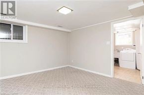 Milton (Mn Milton North) apartment for rent - A room with a carpeted floor and a washing machine in the corner.