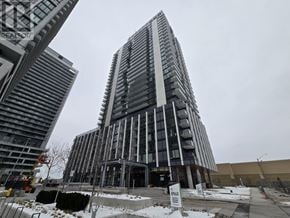 Vaughan (Vellore Village) condo for rent - A tall building with many windows is under construction.