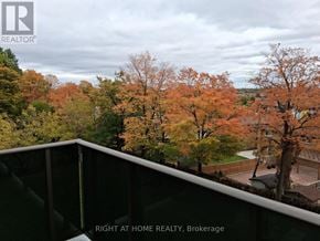Toronto (Glenfield-Jane Heights) apartment for rent - A view from a balcony of a residential area with trees in autumn colors.